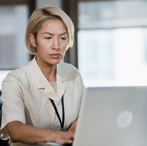 Team member working at a computer, reviewing incoming B2B web orders before posting them to Business Central.